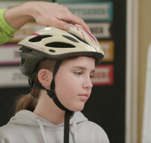 video cover of girl wearing helmet